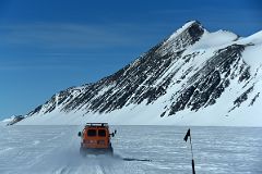 13A ALE Van Driving From Union Glacier Runway To Glacier Camp With Mount Rossmann On The Way To Climb Mount Vinson In Antarctica.jpg